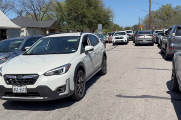 Cars and pedestrians cause a traffic jam on Ramsey Ave.